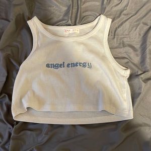 vlight blue (almost white) crop tank top with baby blue lettering “angel energy”